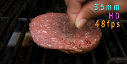 Seasoning Burgers On The Grill