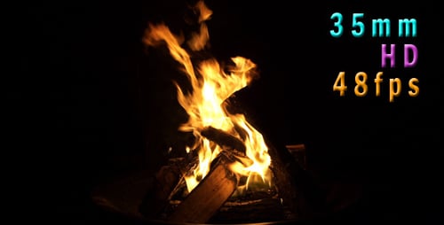 Burning Firewood with Bright Flames in Dark Setting