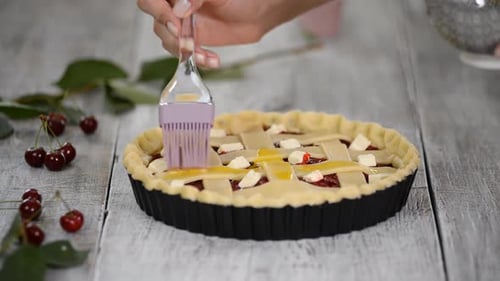 Close Up of Cherry Pie Being Glazed