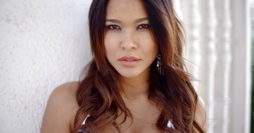 Beautiful Woman Posing and Touching Her Hair