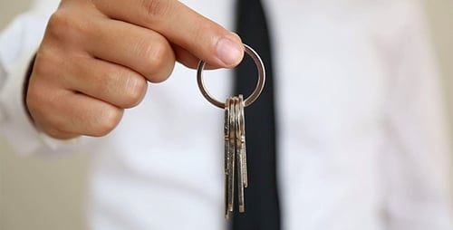 Hand Holding Keys on Ring Close Up