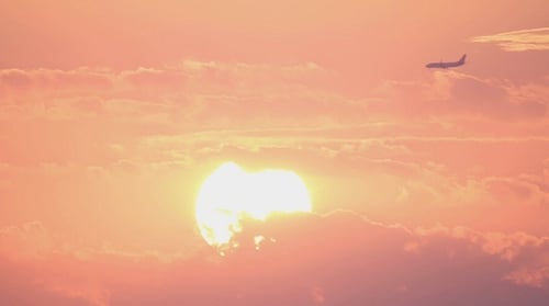 Vibrant Sunrise Through Clouds in Time Lapse