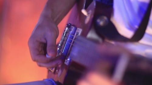 Man Plaing Guitar