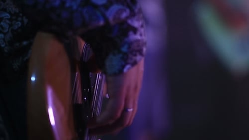 Close Up of Guitarist Playing Bass Guitar