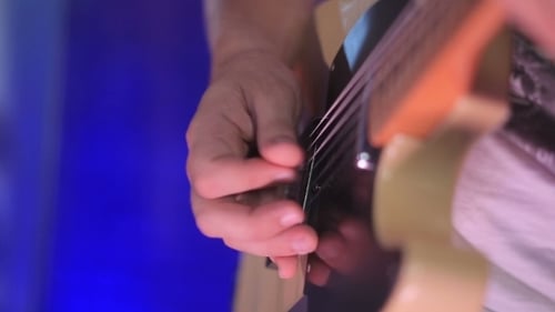 Man Playing Guitar