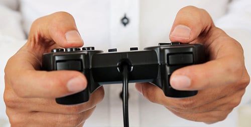 Hands Play Video Game with a Wired Controller