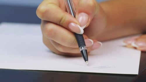 Hand Writes The Word Close Up