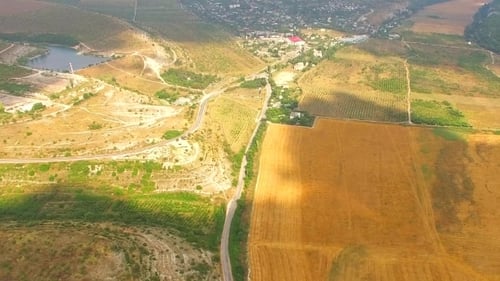 Scenic Aerial View of Rolling Hills and Farmlands