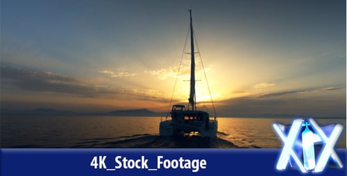 Catamaran Sailing Towards The Sun