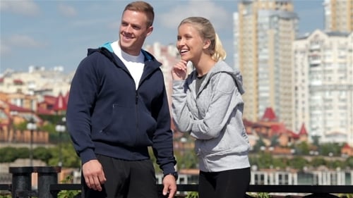 Couple Talking in City on Sunny Day