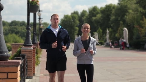 Happy Young Friends Enjoying a Run Outdoors