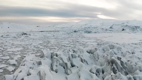 Aerial View of the J Kuls Rl n Glacial Lagoon and Floating Icebergs. The Beginning of Spring in