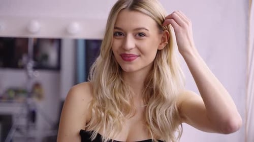 Beautiful Woman with Blonde Hair Posing Indoors