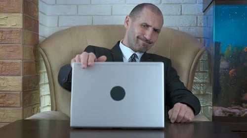 Man Meditating at Desk in Formal Suit