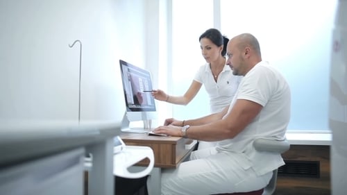 Medical Professionals Reviewing X-Ray Image on Computer