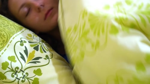 Happy Woman Sleeping In Comfortable Bed