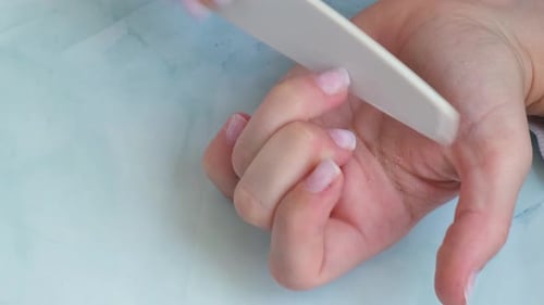 Filing Nails in a Hand Close Up