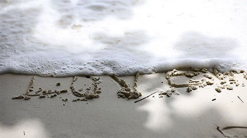 Love Written in Beach Sand With Heart