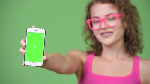 Young Adult Holding Mobile Phone with Green Screen