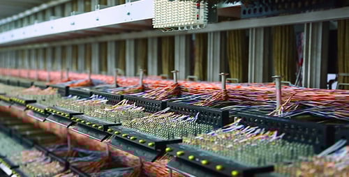 Complex Telecommunications Server Room with Dense Cables