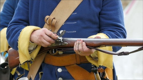 Soldier Loading Musket in Historical War Reenactment
