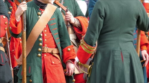 Men in Historical Military Attire Stand in Formation