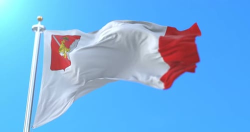 Realistic Waving Flag with Coat of Arms Against Blue Sky