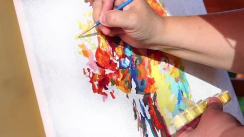 Painting Colorful Image on Canvas Close Up