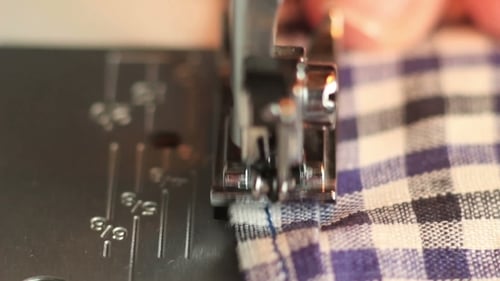 Sewing Machine Stitching Checkered Fabric Close Up