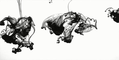 Abstract Black Ink Falling on a White Background