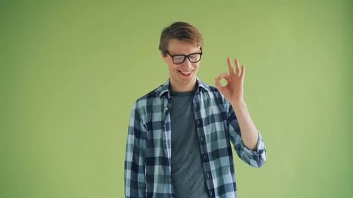 Man Smiling Giving Okay Hand Gesture