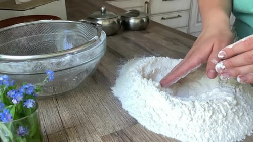 Unrecognizable Female Hands Preparing Flour for Kneading Dough Indoors