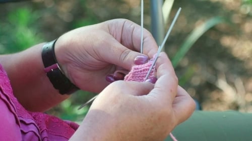 Woman Knitting Pink Yarn Craft Outdoors