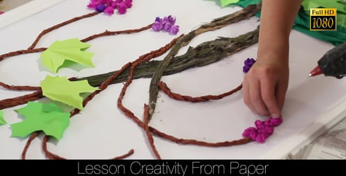 Person Creating Artistic Grape Vine With Paper