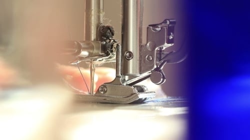 Sewing Machine Needle Stitching Fabric Close Up