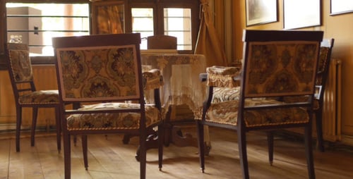 Elegant Antique Chairs Surrounding a Small Table