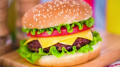 Delicious Hamburger with Cheese and Vegetables Close Up