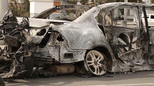Devastating Aftermath: Car Crash Ruins in Urban Setting