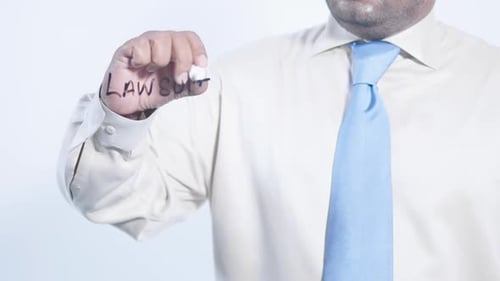 Asian Businessman Writes Law Suit