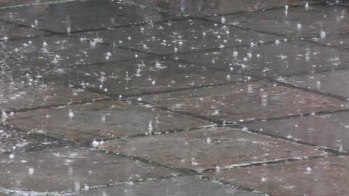 Heavy Rain Falling on Tiled Surface