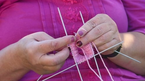 Woman Knitting Pink Yarn Close Up