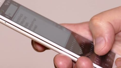 Typing a Message on a White Smartphone
