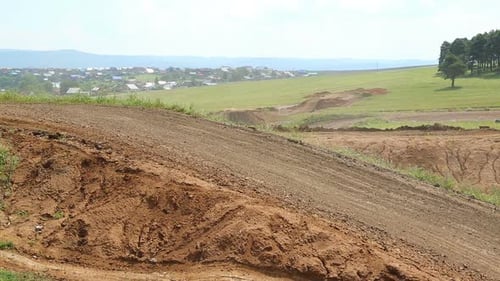 Motocross Competition On A Hilly Road 3