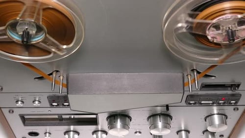 Vintage Reel-to-Reel Tape Recorder Playing Audio