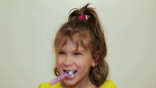 Pretty Little Girl Brushing Her Teeth 2