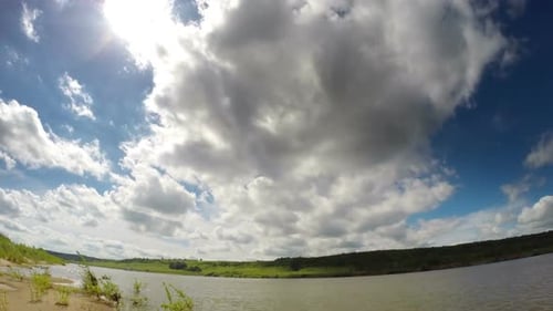 Clouds Moving Over River - Wide-Angle Shot