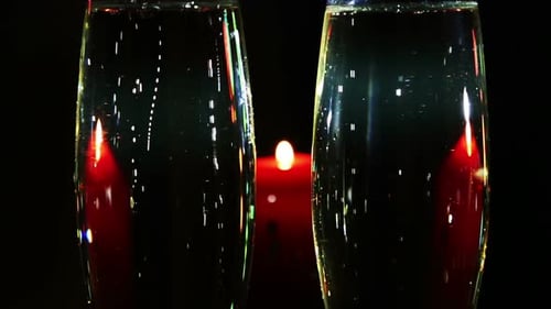Champagne Toast With Romantic Candlelight Setting