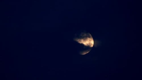 Moon Moving Between Clouds 2
