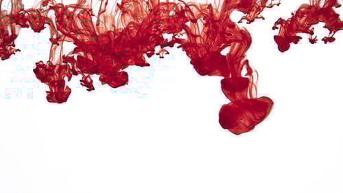 Red Ink Dissolving and Swirling in Water