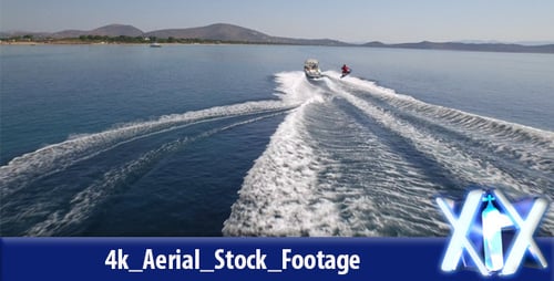 Wake Surfer Towed by Speedboat in Ocean